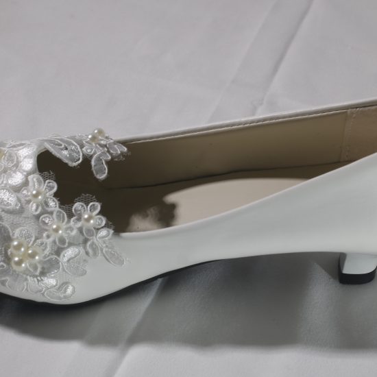 white lace wedding shoes low heel at Tabasamu Bridals and Boutique in Kenya